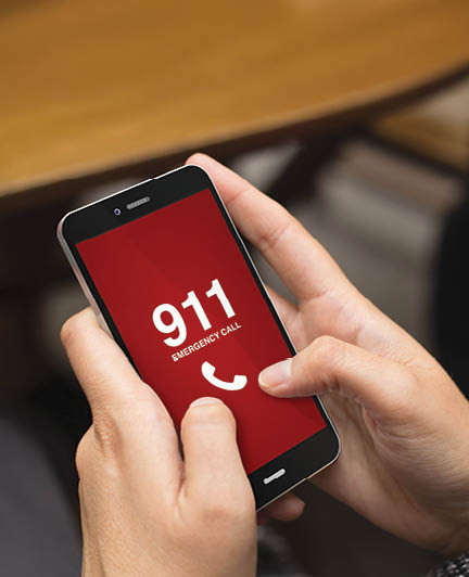 emergency concept: girl using a digital generated phone with emergency call on the screen. All screen graphics are made up.