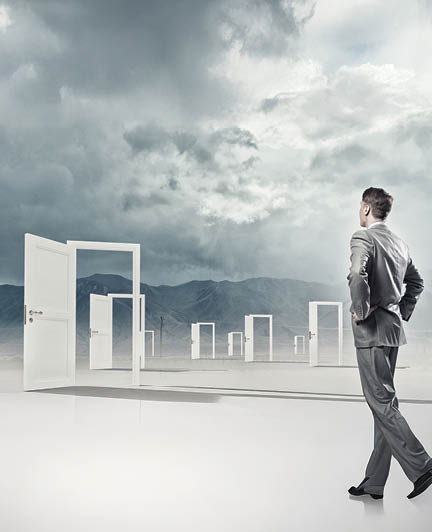 Businessman standing in front of opened doors and making decision